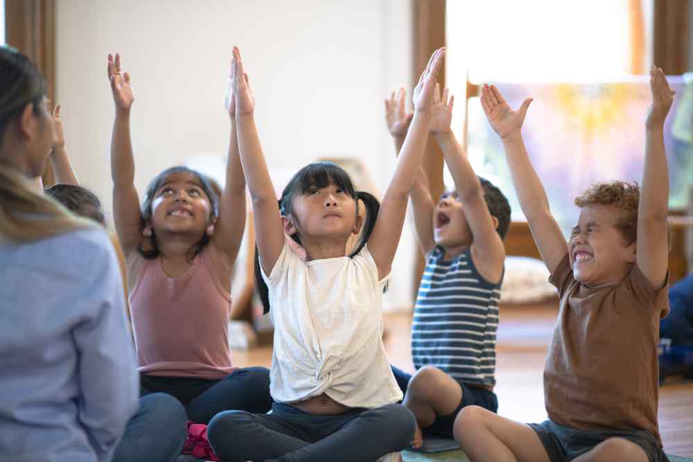 Newtown Therapy | School children practicing yoga